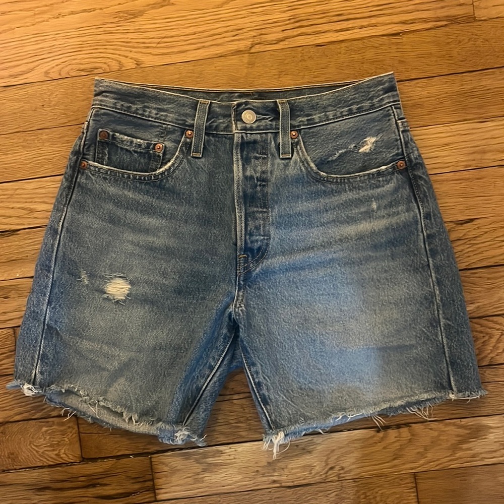 Size 26, Levi’s cutoff midi shorts, medium wash